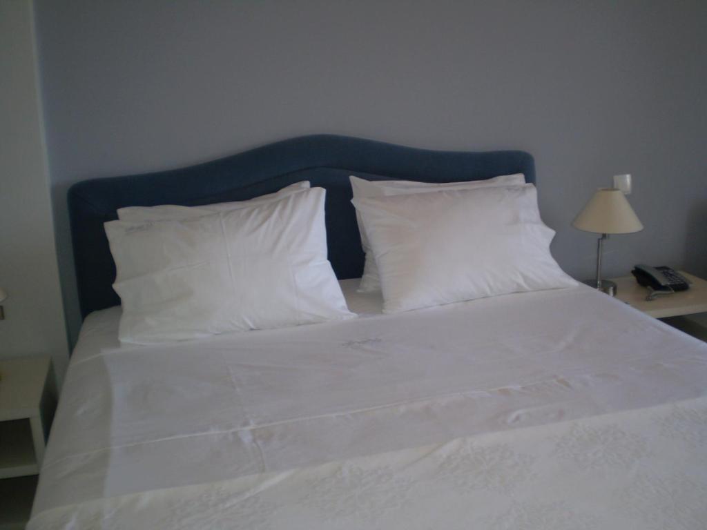 Postel nebo postele na pokoji v ubytování Athena Hotel