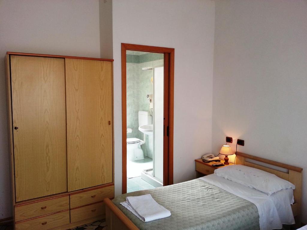 Postel nebo postele na pokoji v ubytování Hotel Clodia