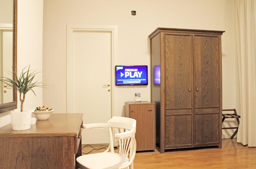 TV a/nebo společenská místnost v ubytování Hotel La Pace