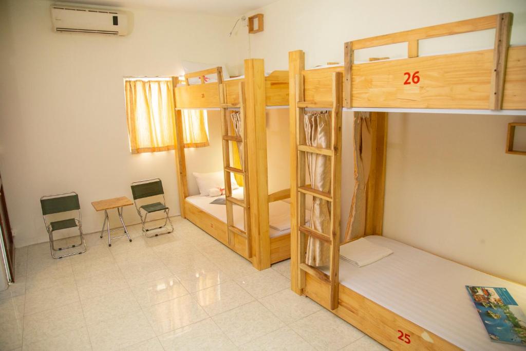 Postel nebo postele na pokoji v ubytování Hanoi City Backpackers Hostel