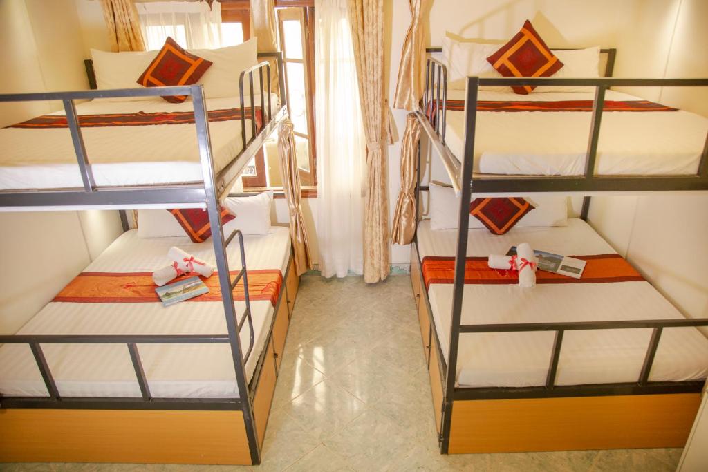 Postel nebo postele na pokoji v ubytování Hanoi City Backpackers Hostel