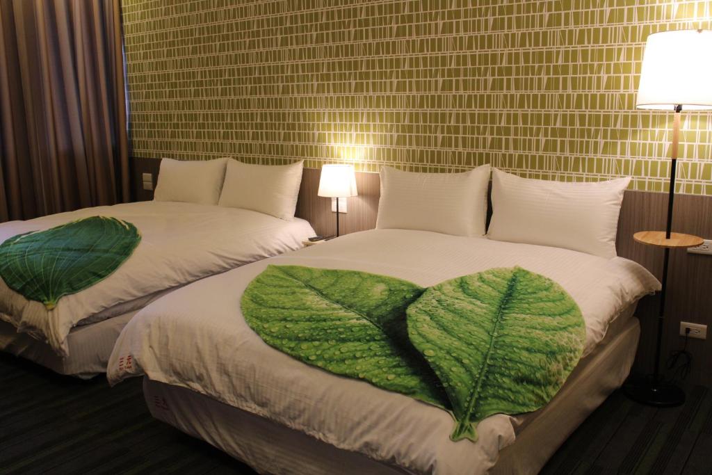 Ένα ή περισσότερα κρεβάτια σε δωμάτιο στο San Yuan Guest House