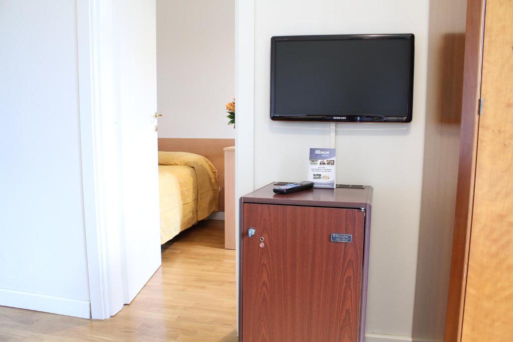 Postel nebo postele na pokoji v ubytování Hotel La Pace