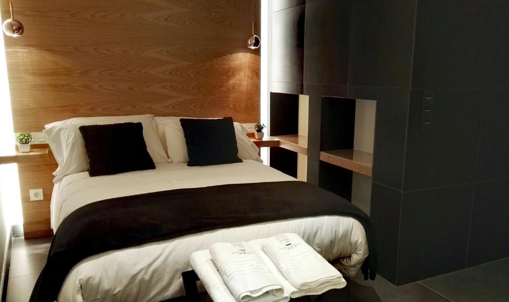 Postel nebo postele na pokoji v ubytování Salamanca Suites Libertad