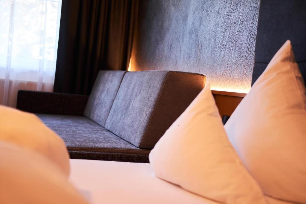 Postel nebo postele na pokoji v ubytování Hotel Post