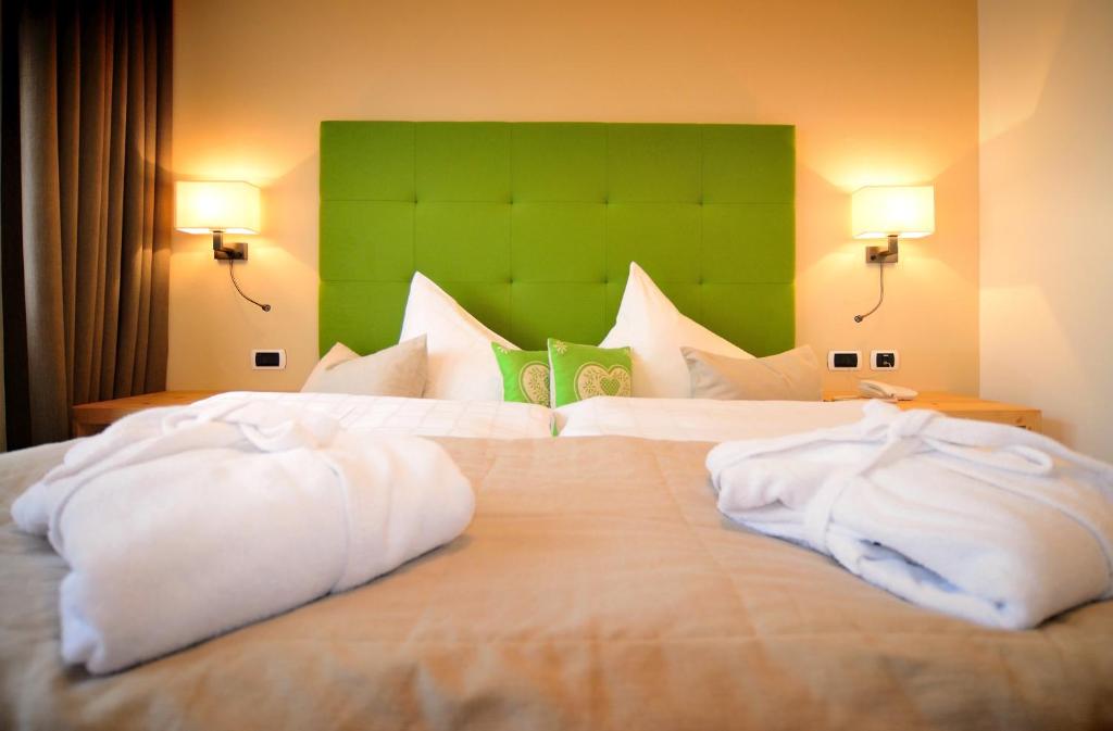 Postel nebo postele na pokoji v ubytování Hotel Brunnerhof