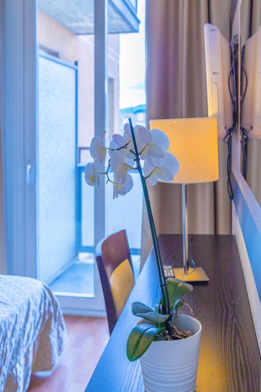 Postel nebo postele na pokoji v ubytování Suite Hotel Elite
