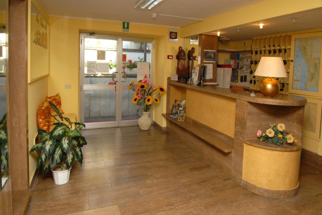 Kuchyň nebo kuchyňský kout v ubytování Hotel Baia Del Sorriso