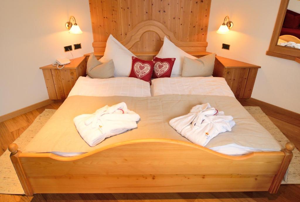 Postel nebo postele na pokoji v ubytování Hotel Brunnerhof