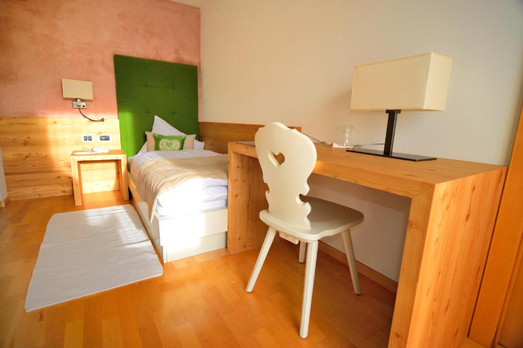 Postel nebo postele na pokoji v ubytování Hotel Brunnerhof