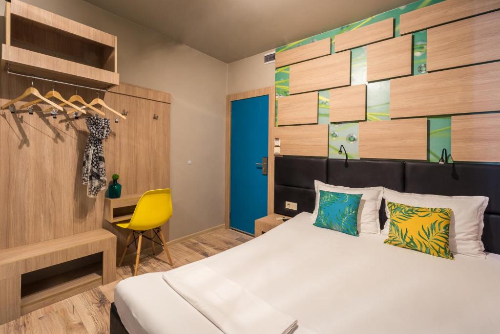 Postel nebo postele na pokoji v ubytování Hotel Allur