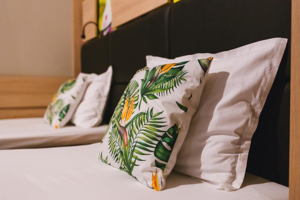 Postel nebo postele na pokoji v ubytování Hotel Allur