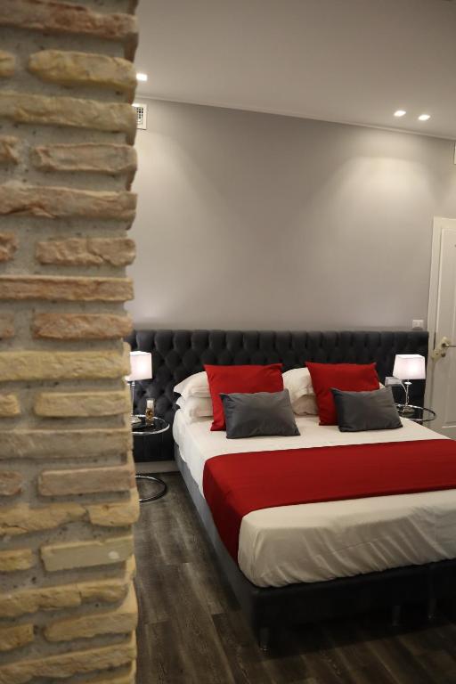 A bed or beds in a room at MILLINA SUITES IN NAVONA