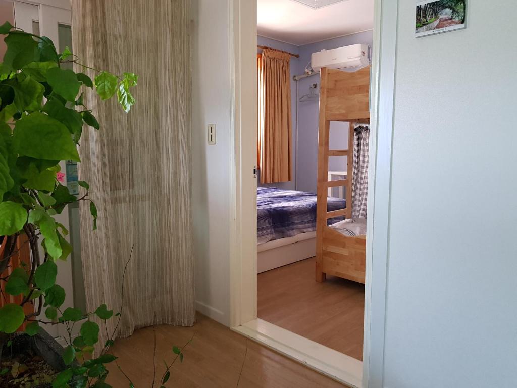 Postel nebo postele na pokoji v ubytování Tongyeong Episode Guesthouse