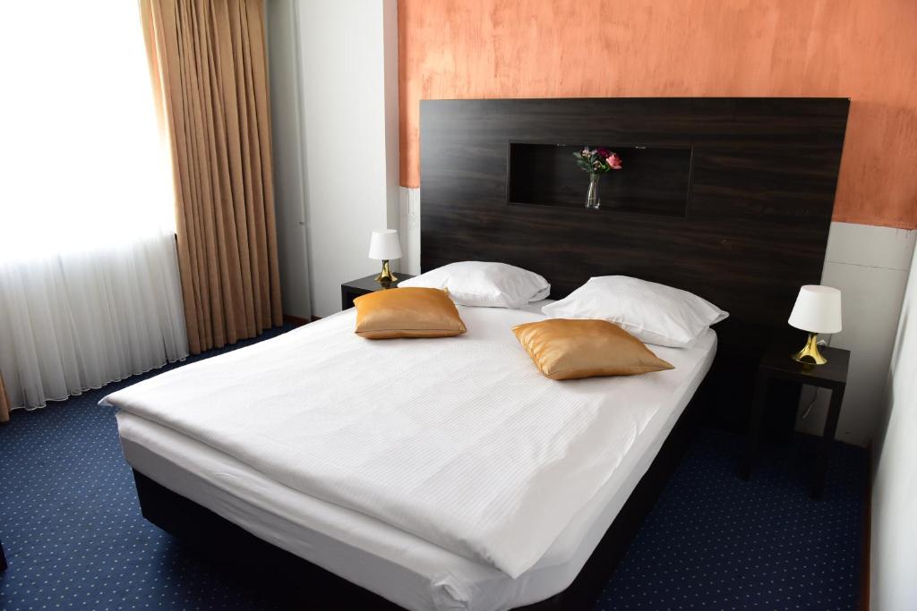 Postel nebo postele na pokoji v ubytování Hotel Töss