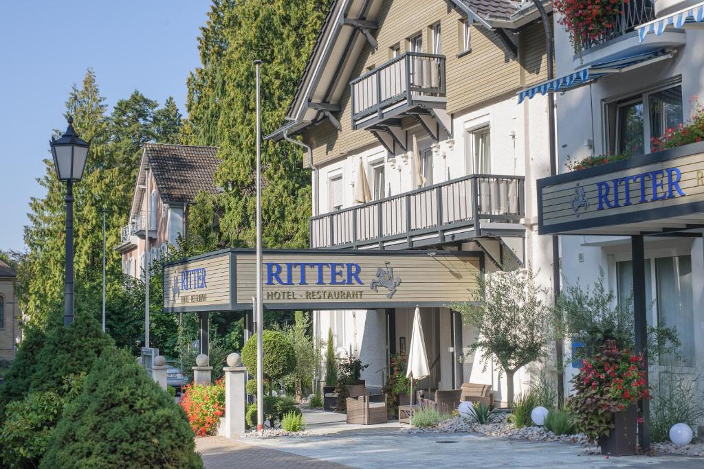 a building with a sign for a hotel at Hotel Ritter Badenweiler in Badenweiler