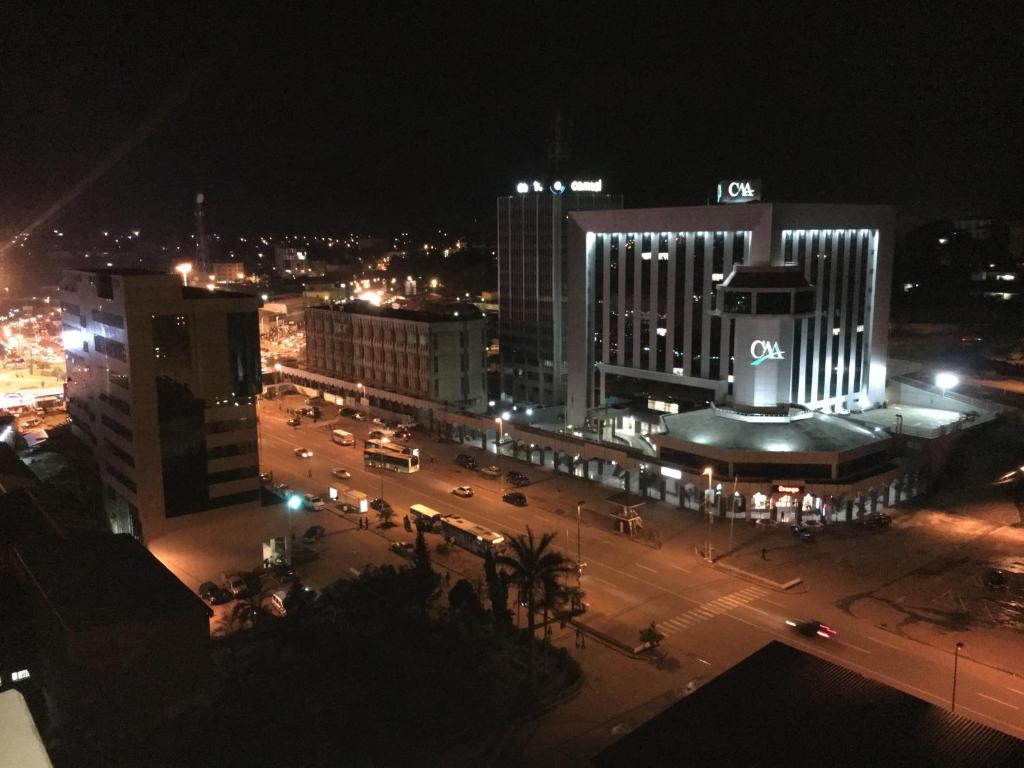 a view of a city at night with at Djeug'Appart Hôtel in Yaoundé