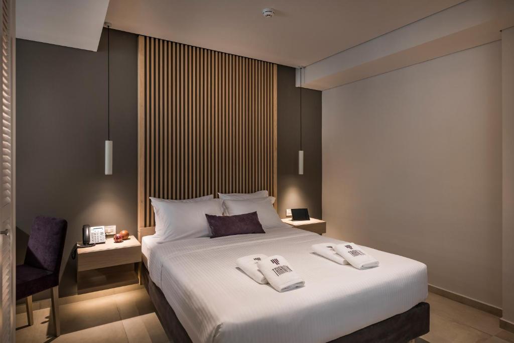 Posteľ alebo postele v izbe v ubytovaní Trianon Luxury Apartments & Suites