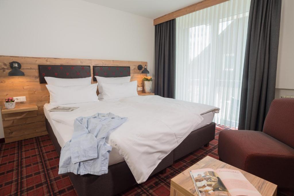 Postel nebo postele na pokoji v ubytování Hotel Kammerer