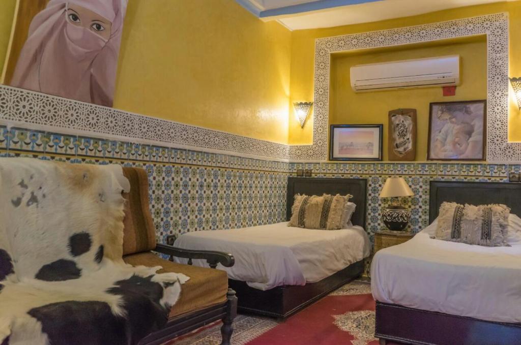 Postel nebo postele na pokoji v ubytování Riad Sidi Omar