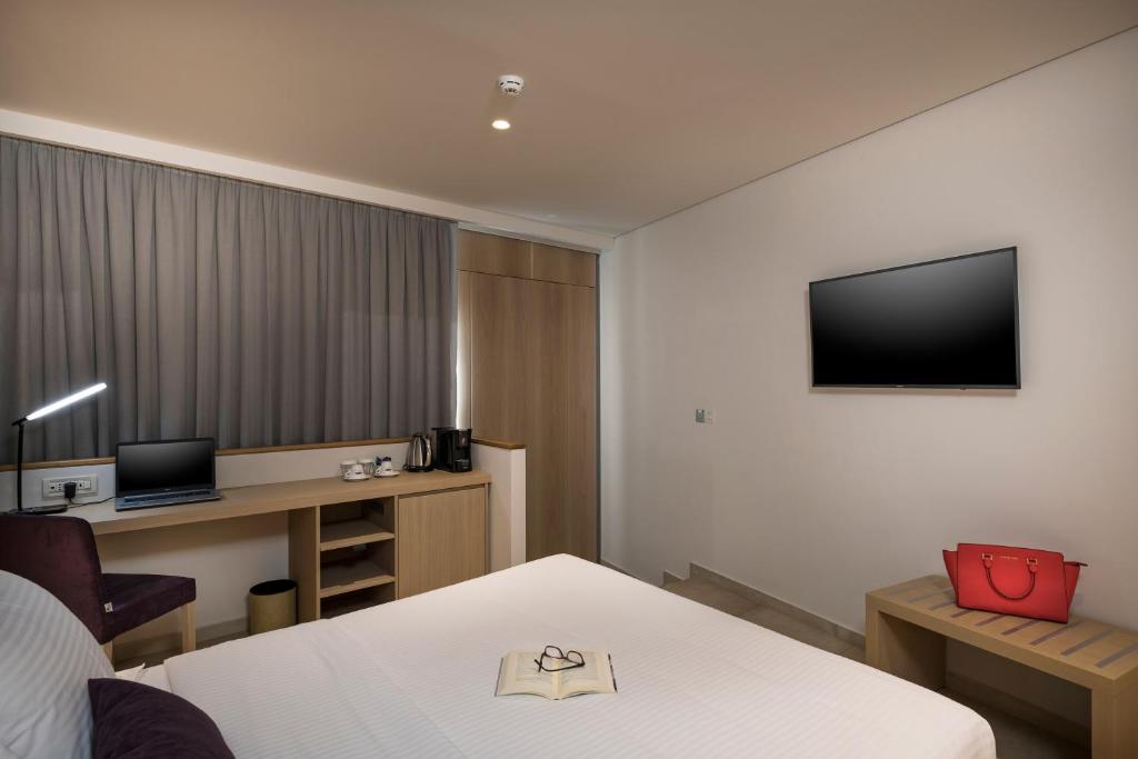 Televízia a/alebo spoločenská miestnosť v ubytovaní Trianon Luxury Apartments & Suites