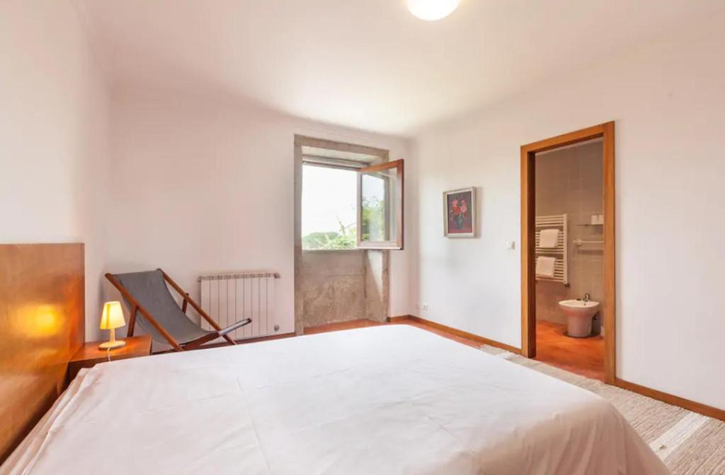 Postel nebo postele na pokoji v ubytování Casa de Sapiao & Studio