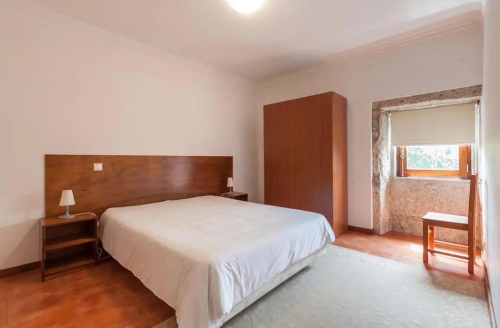 Postel nebo postele na pokoji v ubytování Casa de Sapiao & Studio