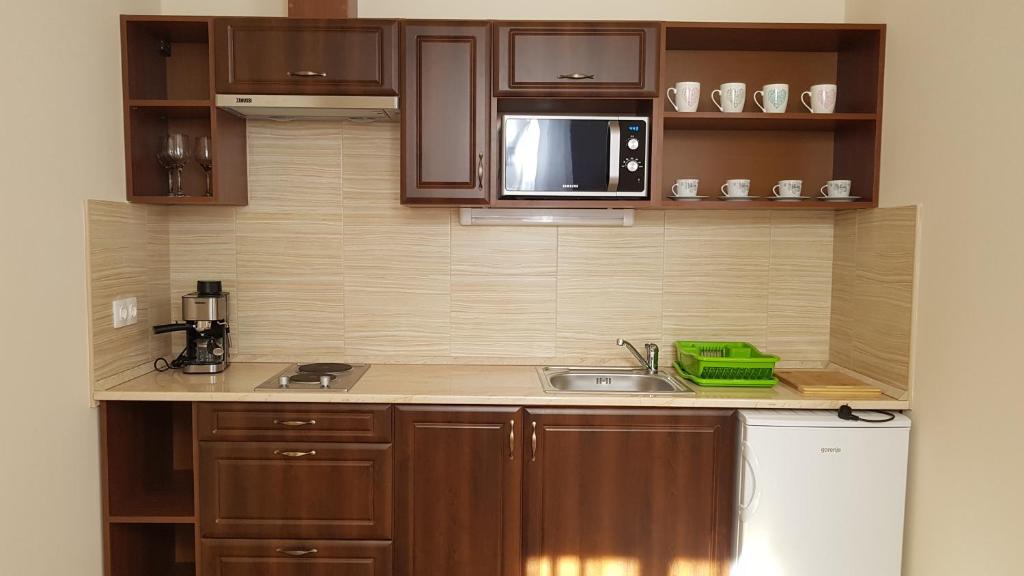 Kuchyňa alebo kuchynka v ubytovaní Toscana Apartman