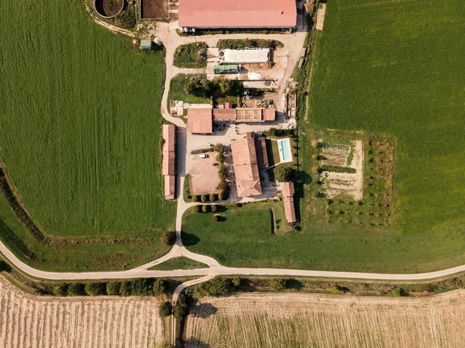 an overhead view of a road in a field at Agriturismo Albero del Latte in Bagnolo San Vito