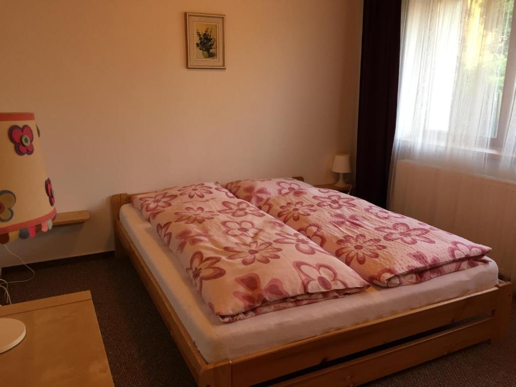 Postel nebo postele na pokoji v ubytování Penzion Na Vyhlídce