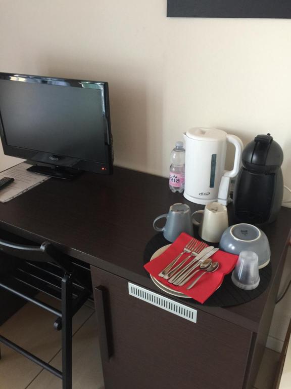 Příslušenství pro přípravu čaje a kávy v ubytování Casa di Giulia