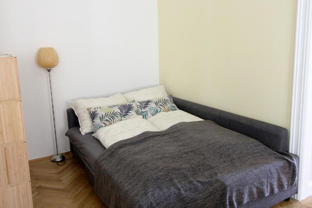 Posteľ alebo postele v izbe v ubytovaní aeki CITY