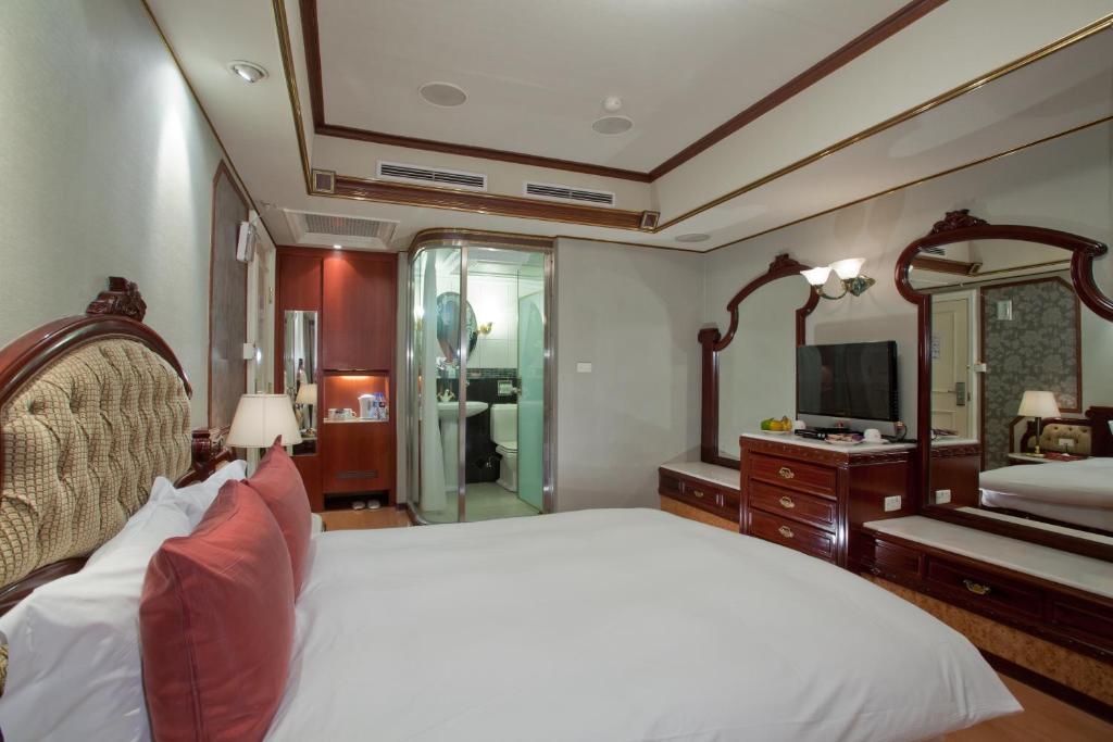 Voodi või voodid majutusasutuse Charming City Songshan Hotel toas