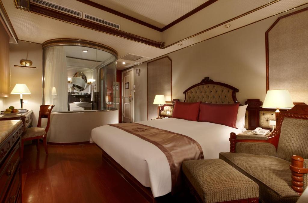 Voodi või voodid majutusasutuse Charming City Songshan Hotel toas