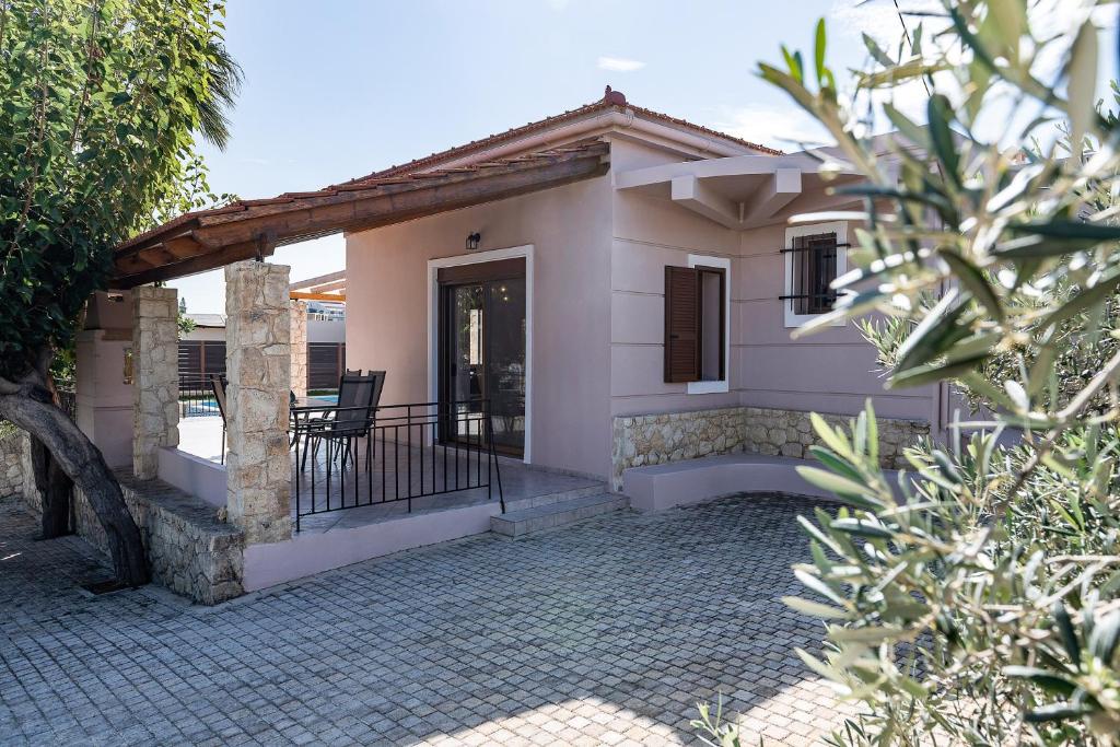 a house with a porch and a patio at Lila hill house in Stalos