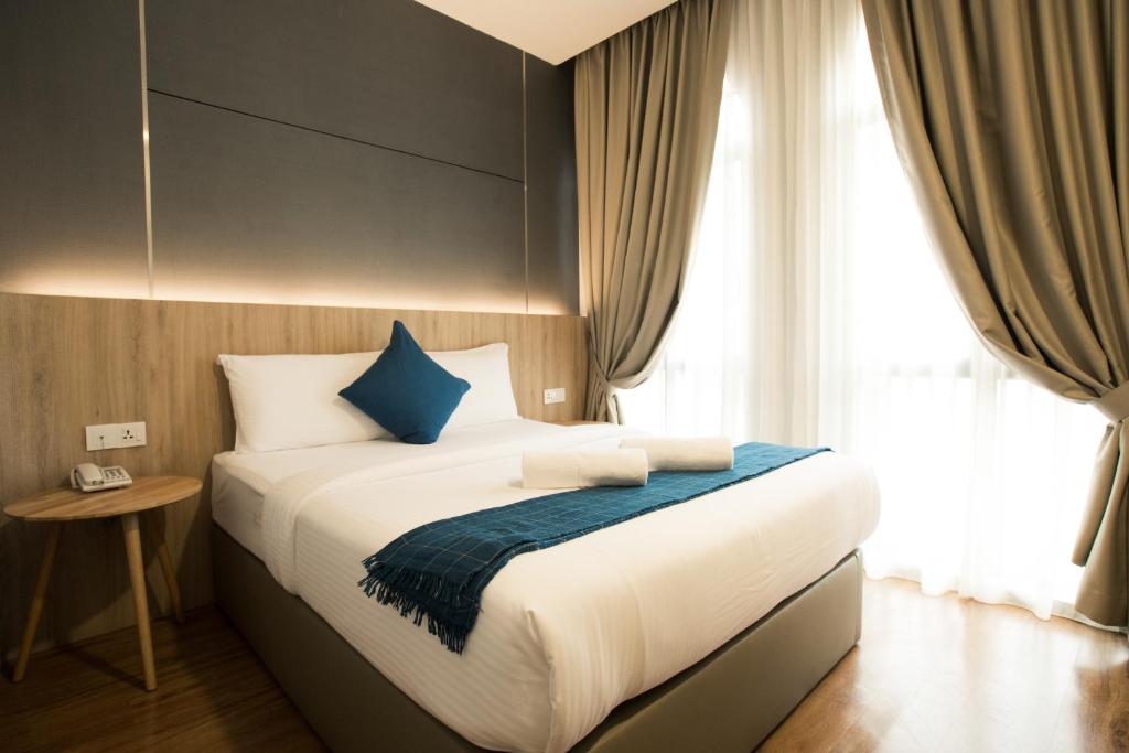 Cama o camas de una habitación en HOTEL CIQ, JALAN TRUS