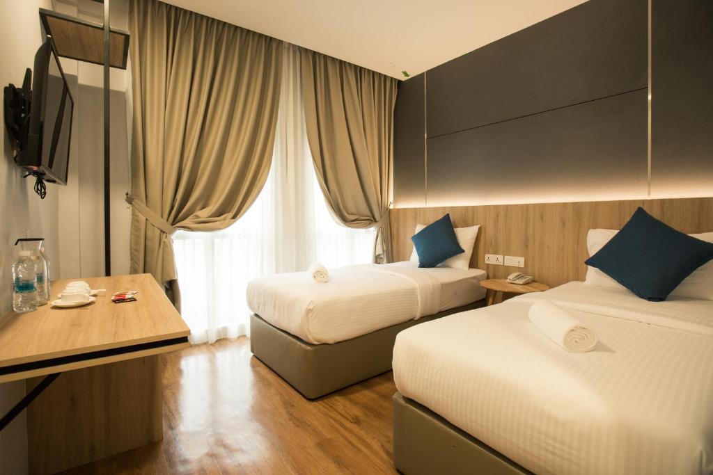 Cama o camas de una habitación en HOTEL CIQ, JALAN TRUS