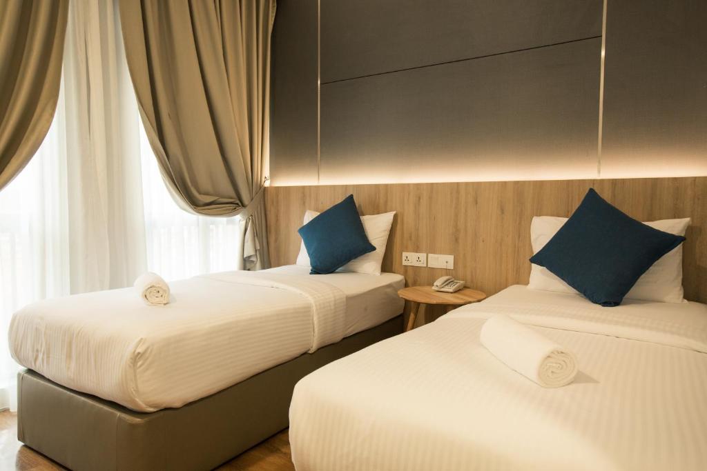Cama o camas de una habitación en HOTEL CIQ, JALAN TRUS