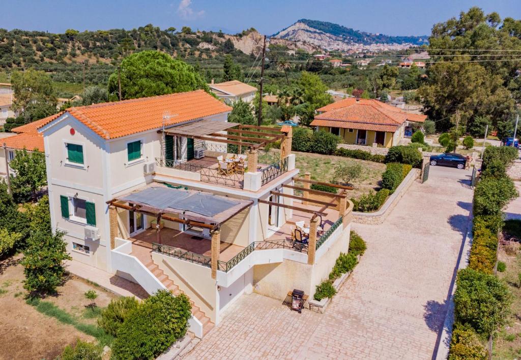an overhead view of a house with an orange roof at Villa Iliogenniti in Kalamaki