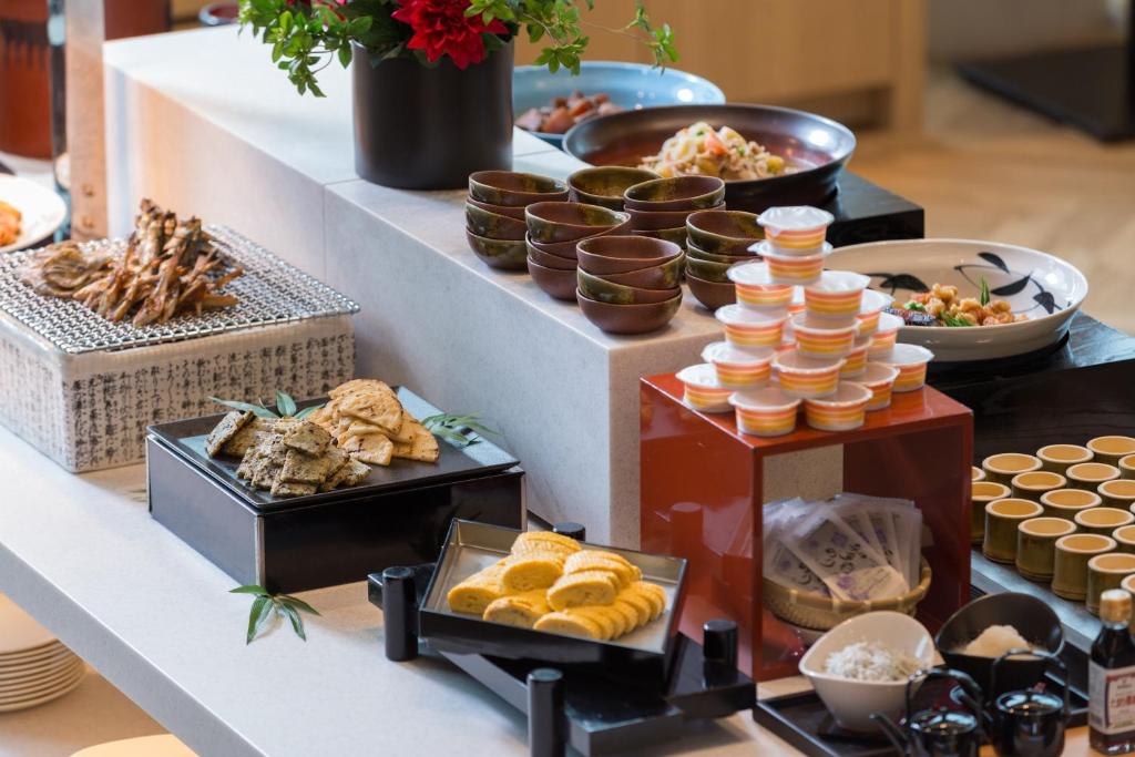 a buffet with different types of food on a table at Centrair Hotel in Tokoname