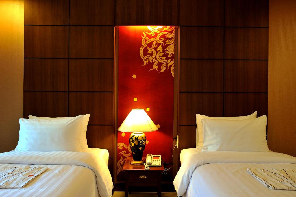 Postel nebo postele na pokoji v ubytování Mariya Boutique Hotel At Suvarnabhumi Airport