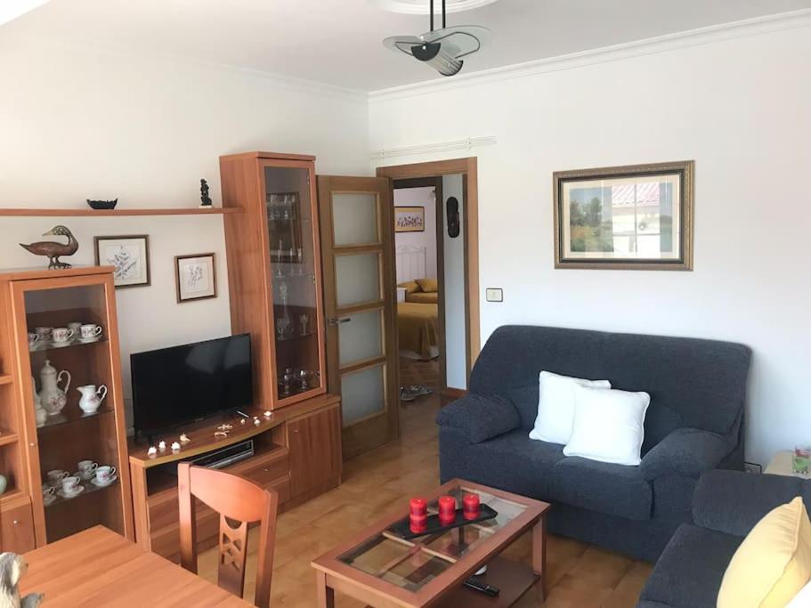 TV a/nebo společenská místnost v ubytování Apartamento Laura