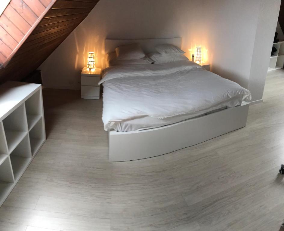 Postel nebo postele na pokoji v ubytování Residence Vue Chateau