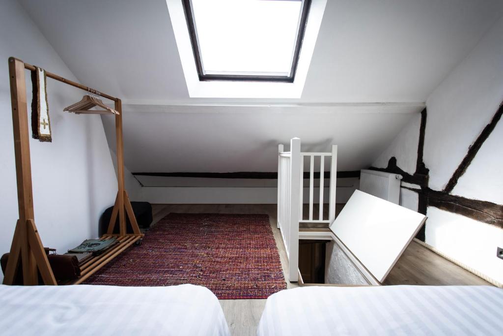 Postel nebo postele na pokoji v ubytování Appartement atypique - coeur historique de Liège