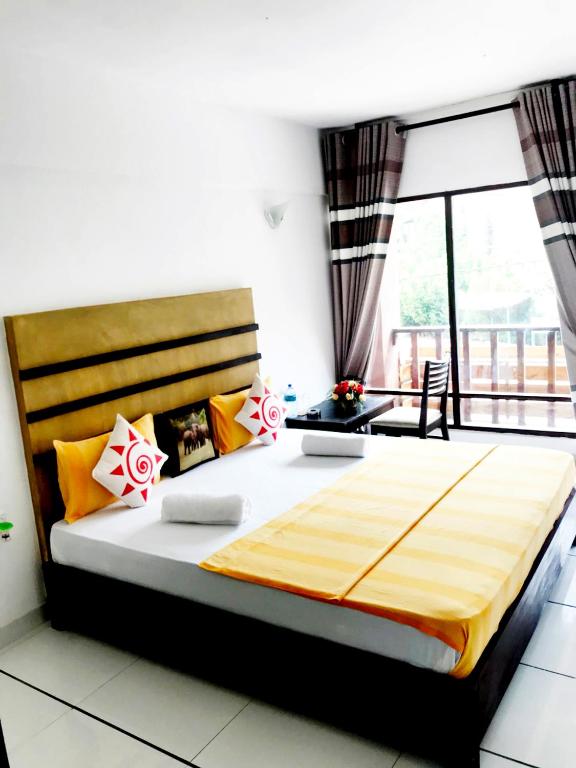 Postel nebo postele na pokoji v ubytování 360 Beach Residence