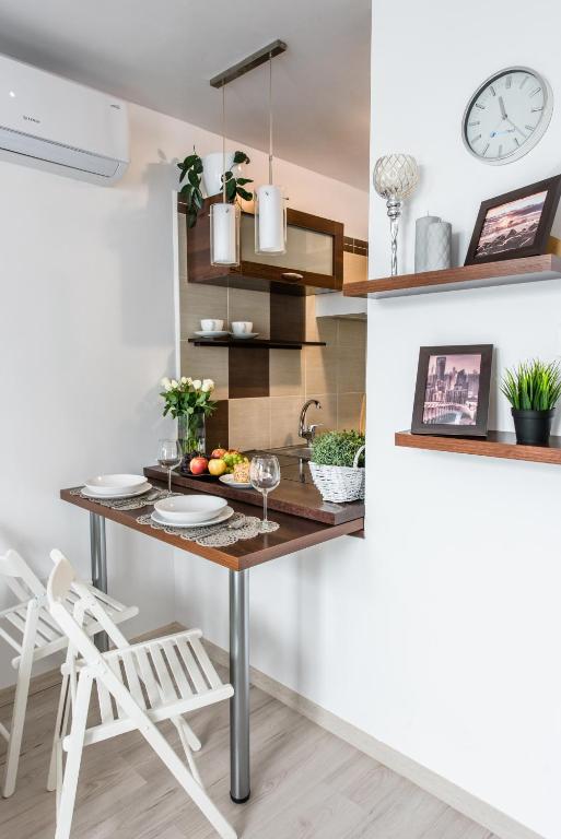 Kuchyň nebo kuchyňský kout v ubytování Alma Apartments Grzybowska