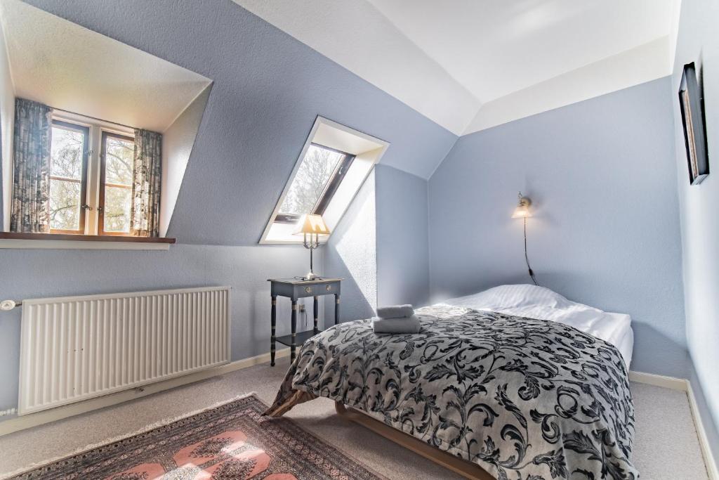 Postel nebo postele na pokoji v ubytování Sonnerupgaard Hotel & Konference
