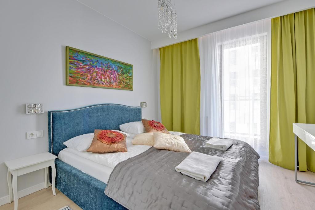 Posteľ alebo postele v izbe v ubytovaní Staywin Apartments Chmielna Park