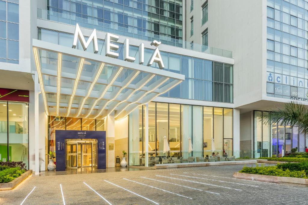 a large building with a clock on the front of it at Meliá Maputo Sky in Maputo