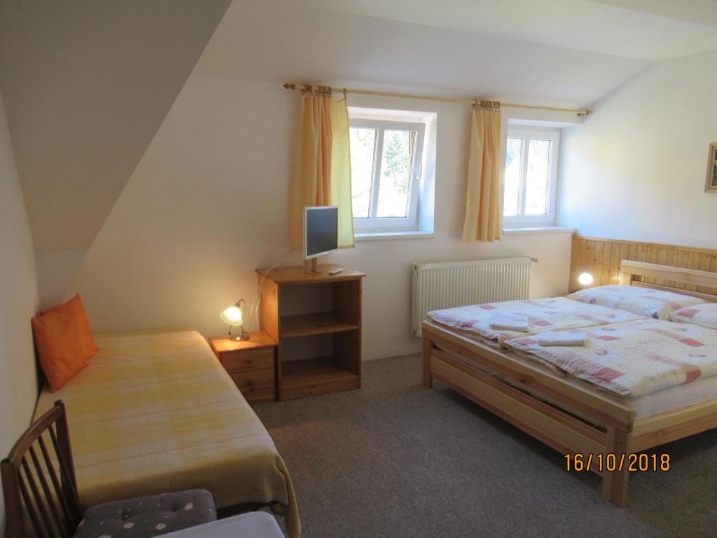Postel nebo postele na pokoji v ubytování Guest House U Marie